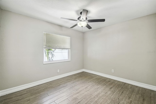 empty room with wood-type flooring and ceiling fan