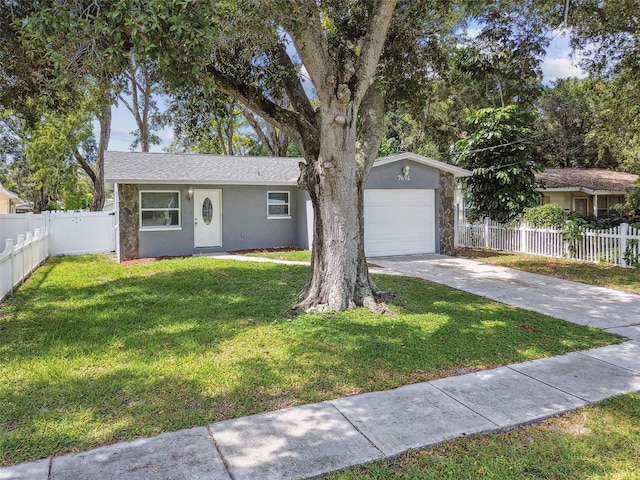 ranch-style house with a front yard and a garage