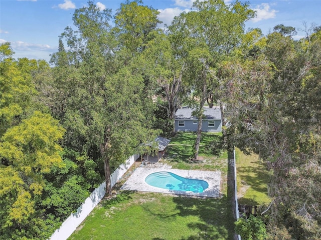 view of pool with a yard and a patio