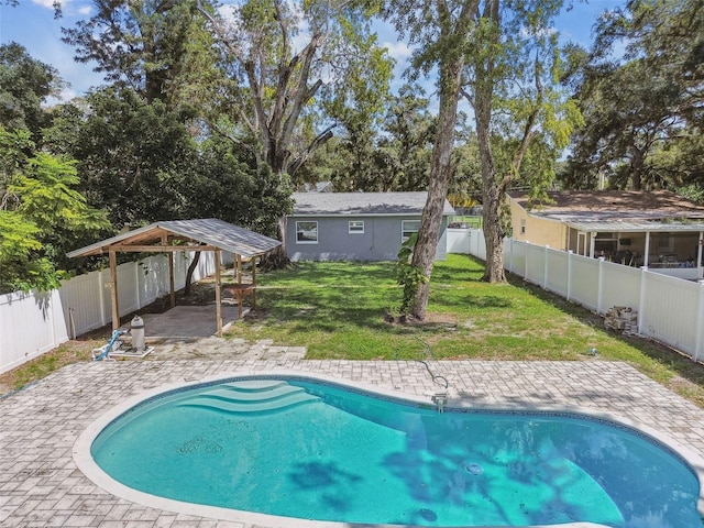 view of swimming pool with a patio, a gazebo, and a yard