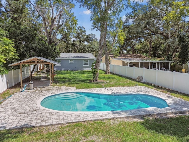 view of pool featuring a patio area and a yard