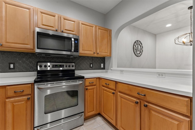 214 Cape Harbour Loop Unit 105, Bradenton, FL 34212 - kitchen with stainless steel appliances, light countertops, and tasteful backsplash