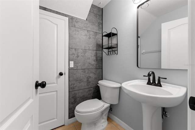 214 Cape Harbour Loop Unit 105, Bradenton, FL 34212 - bathroom featuring toilet and tile patterned floors