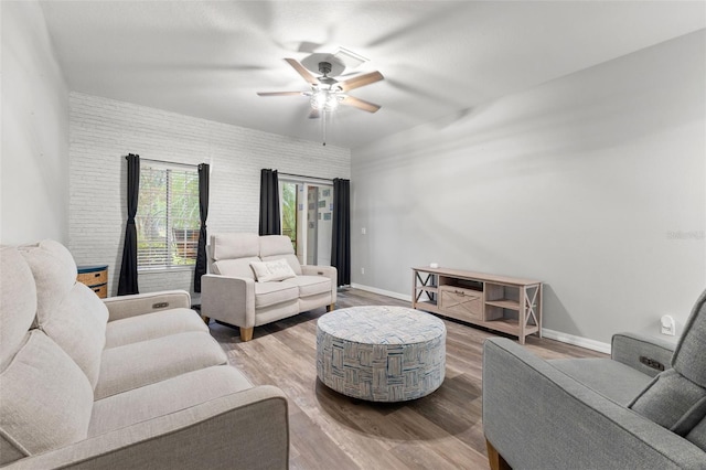 214 Cape Harbour Loop Unit 105, Bradenton, FL 34212 - living area with a ceiling fan, baseboards, and wood finished floors