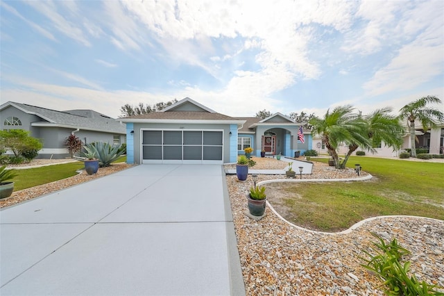 ranch-style home with a front yard and a garage