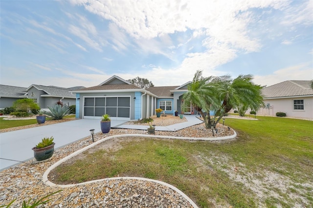 ranch-style home with a front yard and a garage