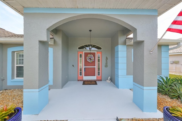 doorway to property featuring covered porch