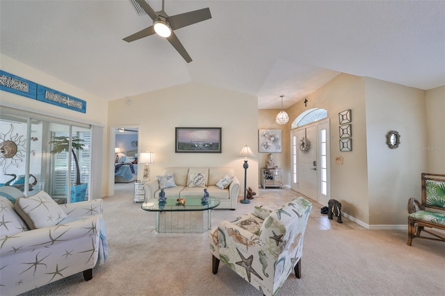 living room with ceiling fan, light carpet, and lofted ceiling