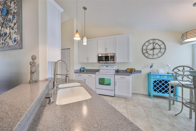 kitchen with sink, white electric stove, lofted ceiling, pendant lighting, and white cabinets