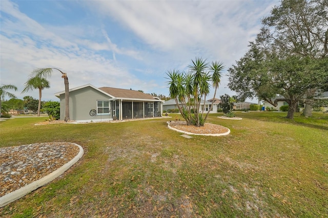 view of yard with a sunroom