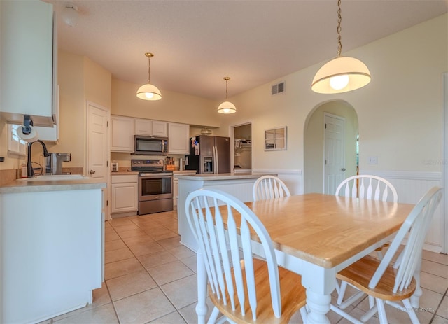 tiled dining area with sink