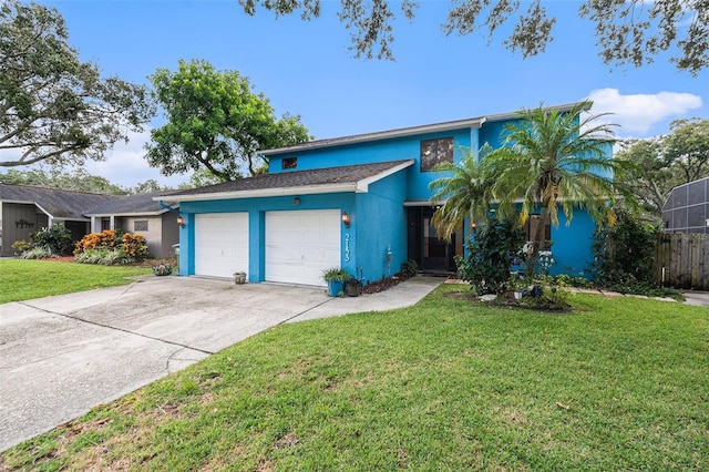 view of front of property featuring a front yard and a garage