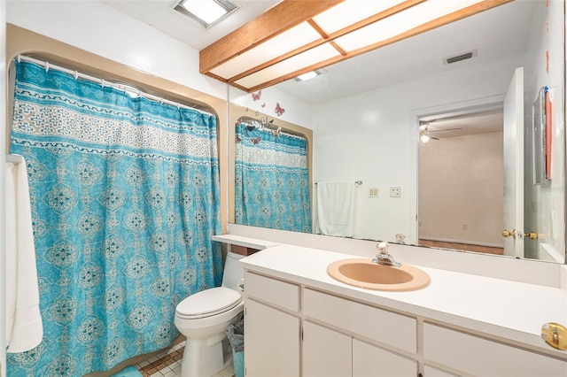 bathroom with vanity, tile patterned floors, a shower with shower curtain, ceiling fan, and toilet