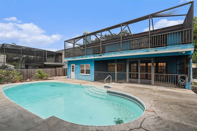 view of pool with a lanai