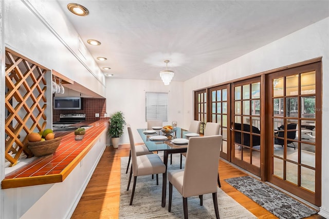 dining area featuring light wood-type flooring