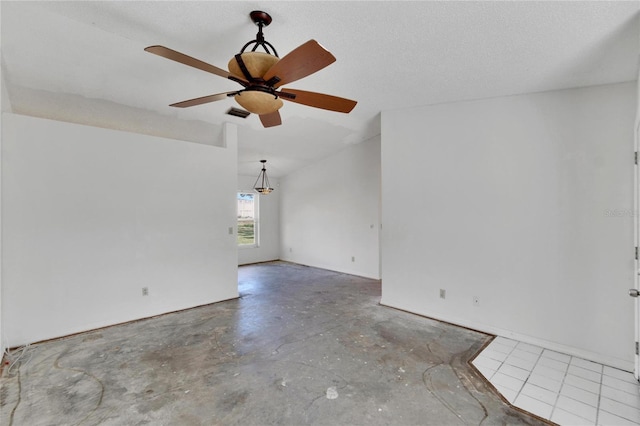 unfurnished room with concrete flooring, a textured ceiling, and ceiling fan