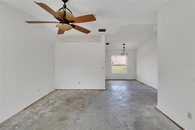 empty room with concrete floors, a textured ceiling, and ceiling fan