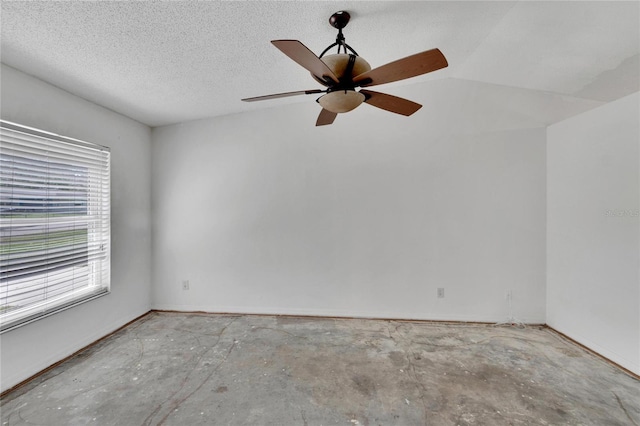 unfurnished room featuring a textured ceiling and ceiling fan