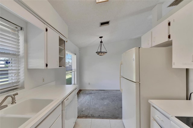 kitchen with white cabinetry, white appliances, a textured ceiling, and hanging light fixtures