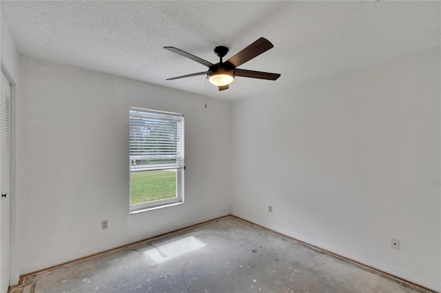 empty room featuring a textured ceiling and ceiling fan