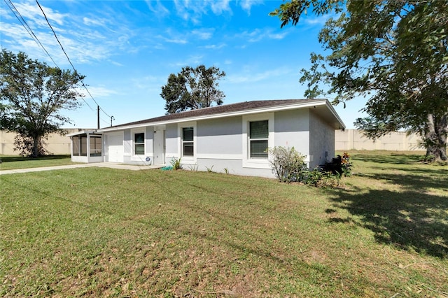 ranch-style house with a front lawn