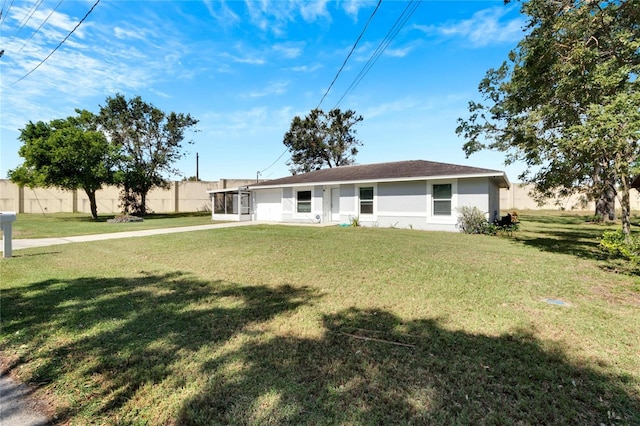 ranch-style home with a front yard