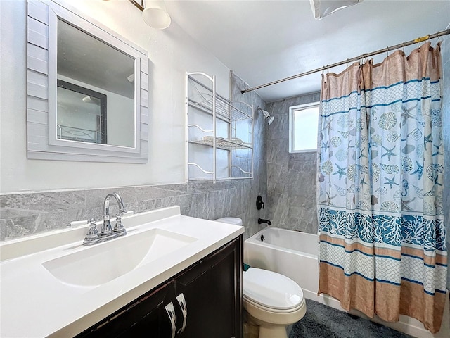 full bath featuring vanity, tile walls, toilet, and shower / bathtub combination with curtain