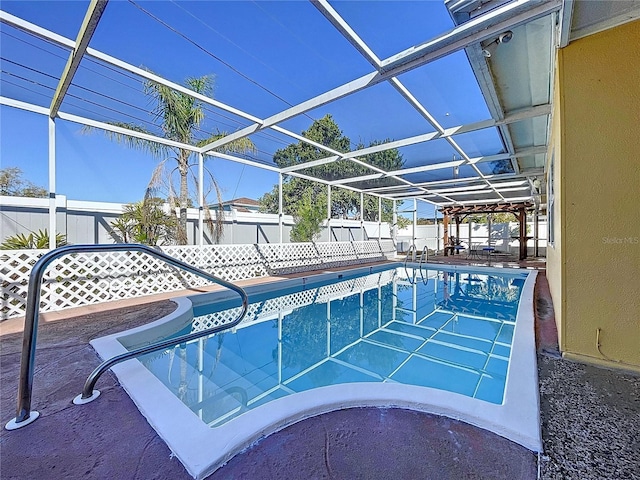 view of swimming pool featuring a lanai, a fenced backyard, a fenced in pool, and a patio