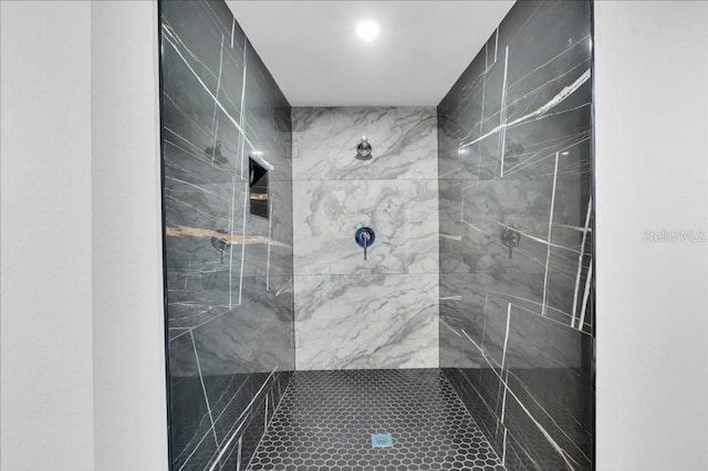 bathroom with a tile shower