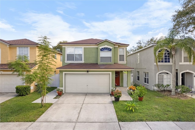 view of front of home with a front lawn and a garage