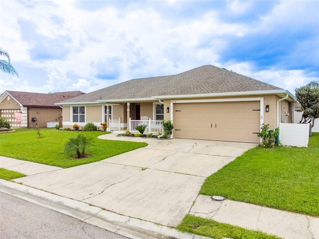 single story home featuring a porch, a garage, and a front yard