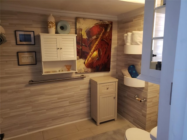 bathroom featuring tile patterned flooring and toilet