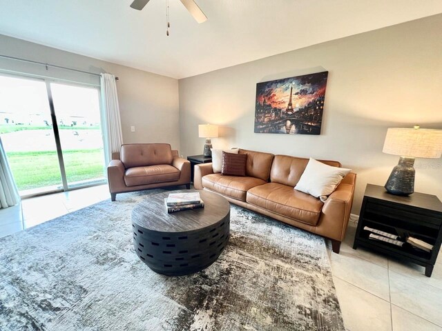 living room with ceiling fan and light tile patterned floors