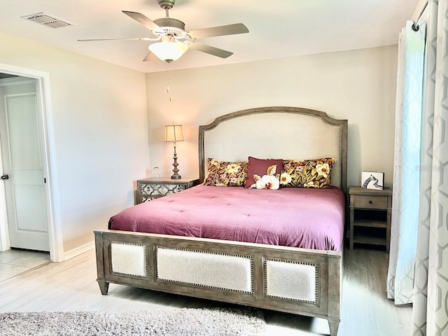 bedroom featuring ceiling fan and light hardwood / wood-style floors