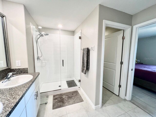 bathroom featuring hardwood / wood-style flooring, vanity, and a shower with shower door