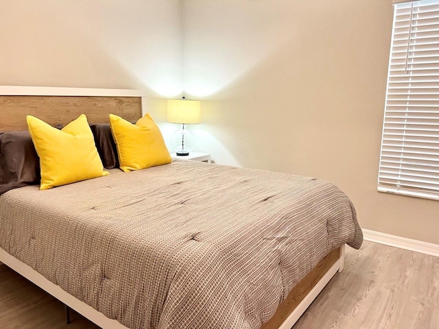 bedroom featuring wood-type flooring