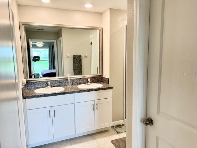 bathroom with vanity and tile patterned flooring