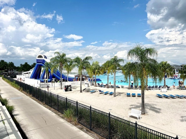 view of jungle gym with a water view