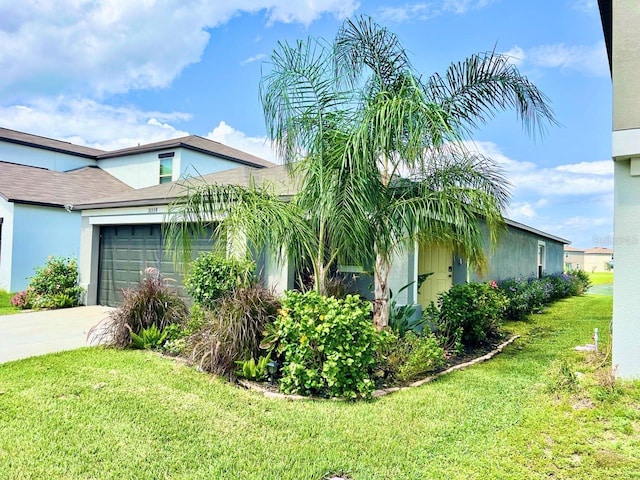 view of home's exterior featuring a lawn and a garage