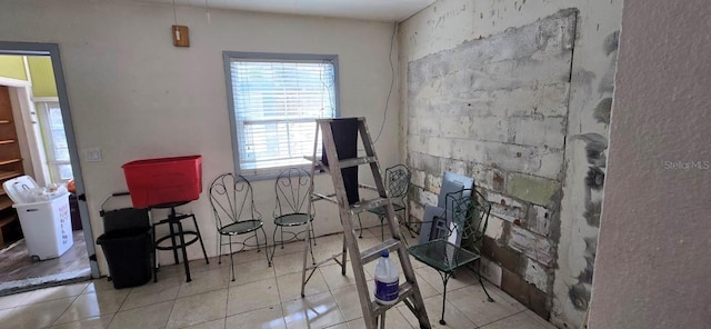 misc room with light tile patterned floors