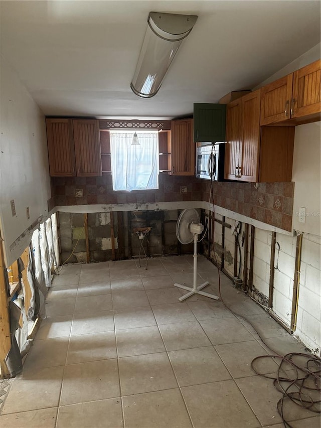 kitchen with light tile patterned flooring