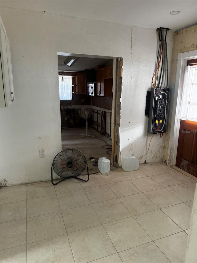 interior space featuring a healthy amount of sunlight and light tile patterned flooring