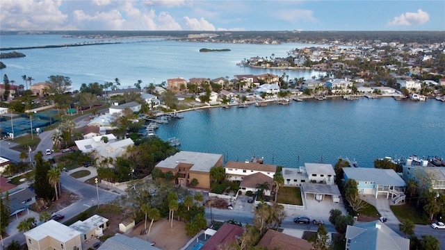 birds eye view of property with a water view and a residential view