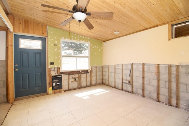 interior space with wood ceiling, wainscoting, vaulted ceiling, and ceiling fan