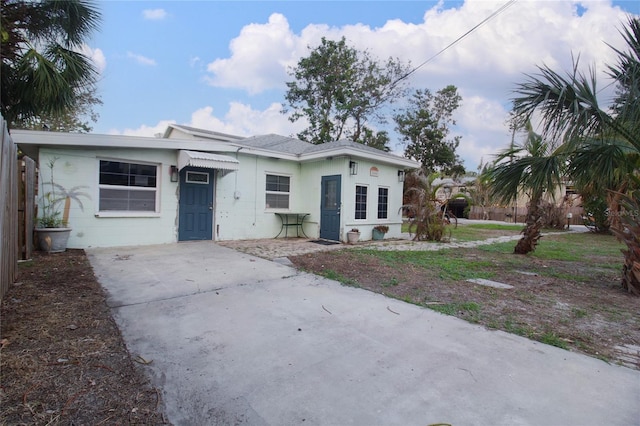 view of front of property with concrete block siding