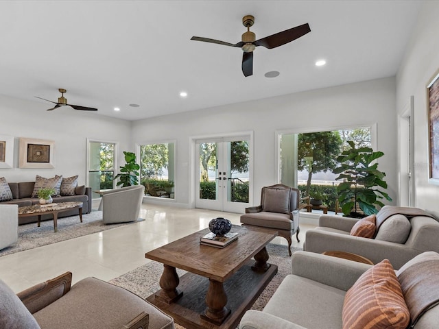 living room featuring french doors and ceiling fan