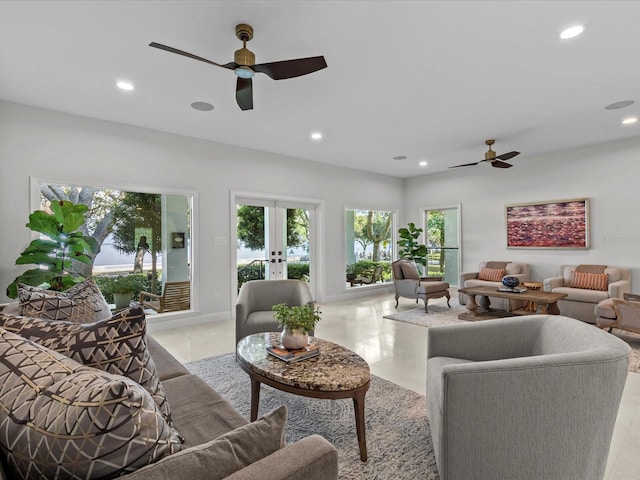 living room with french doors and ceiling fan