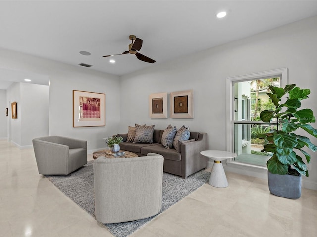 living room featuring ceiling fan