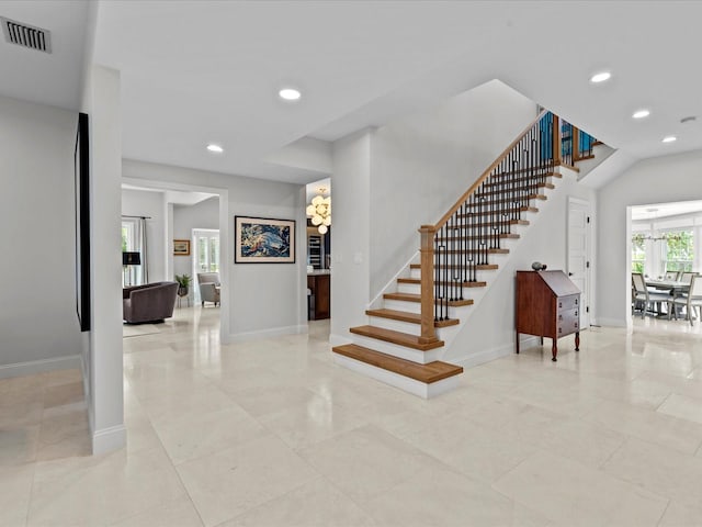 stairway with tile patterned floors