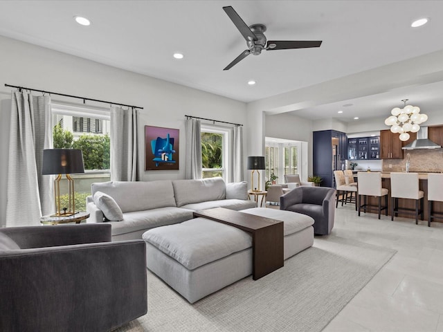 tiled living room featuring a healthy amount of sunlight and ceiling fan